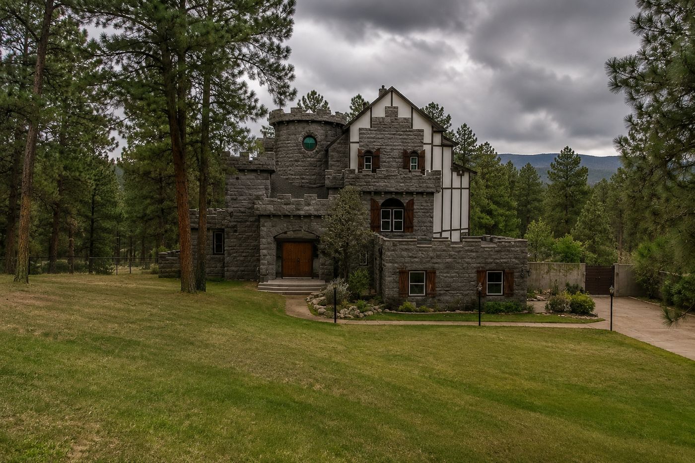 A stone castle home with turrets and crenellations set among tall ponderosa pines on 2.8 wooded acres in Parker, Colorado