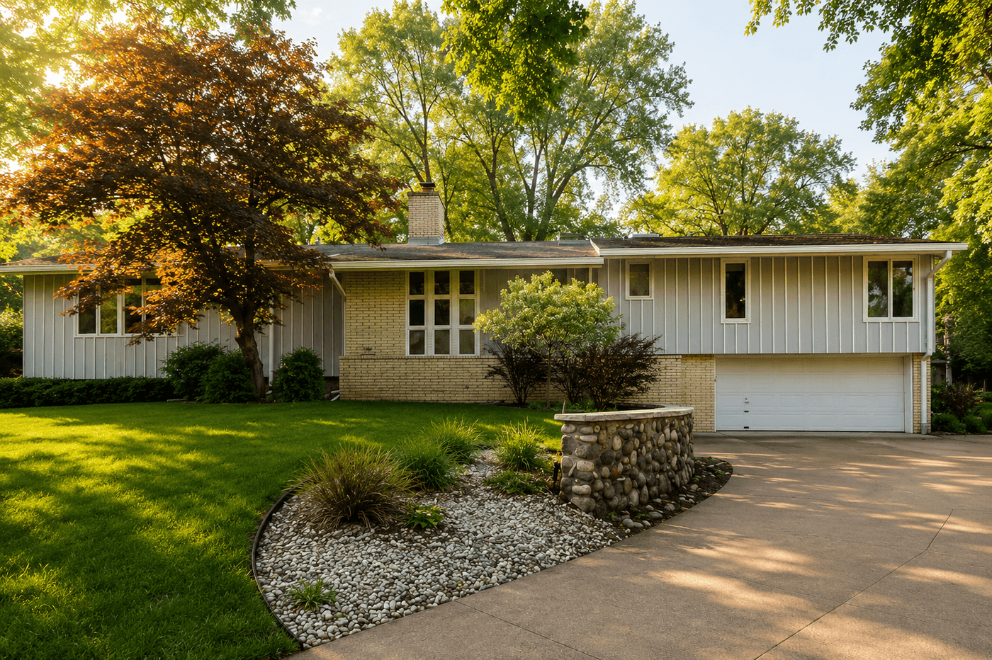 A tree-lined street in Fox Point, Wisconsin with classic mid-century modern homes set back on generous wooded lots